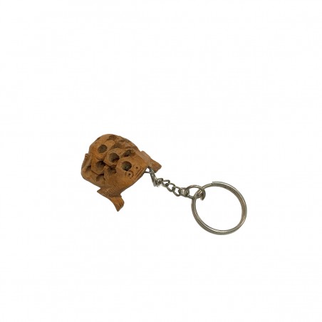 Llavero de madera con forma de animal rana.